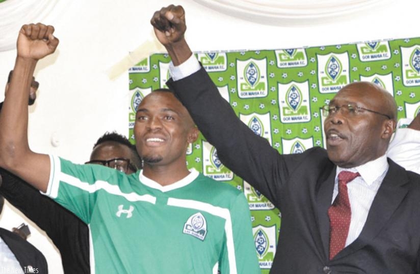 Tuyisenge and Gor Mahia chairman, Ambrose Rachier at his unveiling at Nyayo national stadium. (Courtesy)