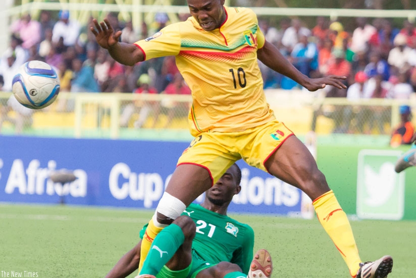 Mali forward Mamadou Coulibaly is tackled by an Cote d'Ivoire defender on Thursday. Mali will face DR Congo in the final of CHAN 2016 on Sunday at Amahoro National Stadium in Kigali. (Timothy Kisambira)