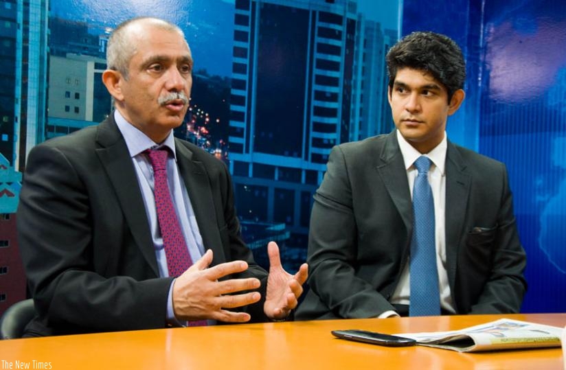 Wahi during the interview with The New Times as his son Sid Wahi, the CEO of CNBC Africa and Forbes Africa, looks on last week.(Teddy Kamanzi)