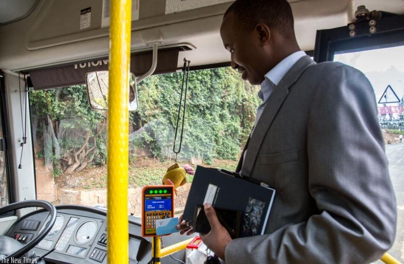 Emmanuel Asaba Katabarwa, the Rwanda Utilities Regulatory Agency head of transport department, launches the smart card service provided by AC Group in November. The service has been rolled out on some city routes. (File)