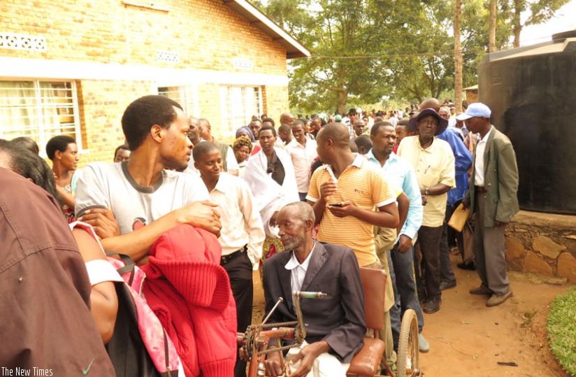 Voters queue during the polls in E. Province yesterday. (Stephen Rwembeho)