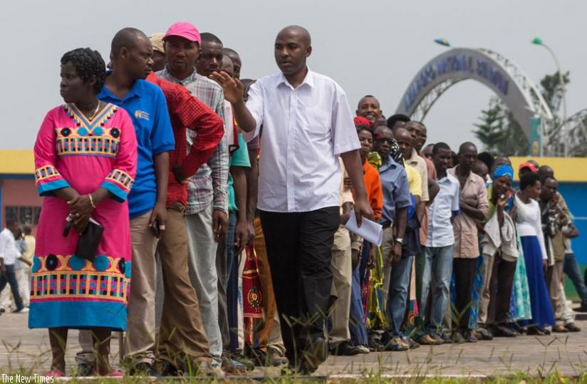 An electoral agent counts votes during the election at Marembo Yambere in Gasabo District yesterday. (Timothy Kisambira)