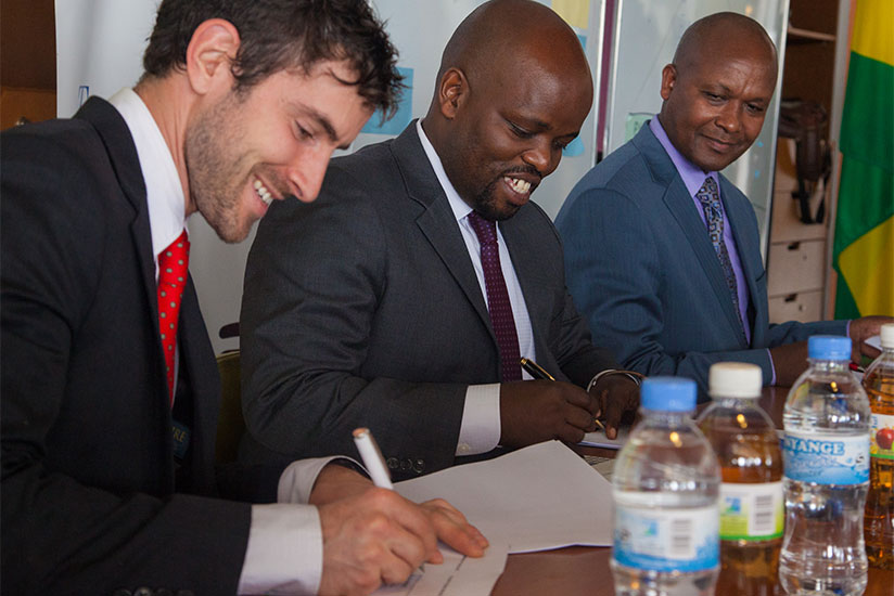 Zipline Inc. CEO Keller Rinaudo signs an agreemet with the Government of Rwanda, represented by Jean-Philibert Nsengimana (Minister of Youth and ICT), and Dr. Jean-Baptiste Mazarti from the Ministry of Health. (Faustin Niyigena)