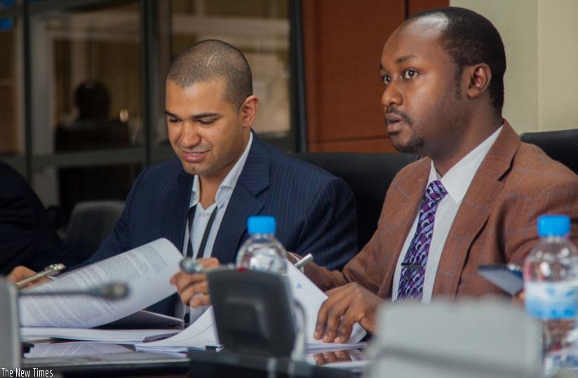 Minister Imena (R) signs the MoU with Tariq Al Barwani, CEO for Tri Metals Mining Limited in Kigali, yesterday. (Faustin Niyigena)