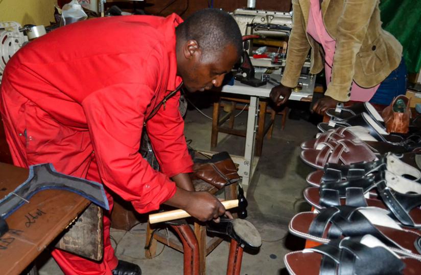 Micheal Habumugisha, from Musanze, in his workshop making leather products. The government has been promoting 'Made-in-Rwanda' products to boost local industries. (File)