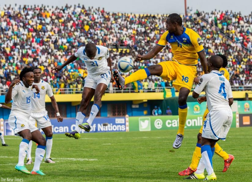 Amavubi striker Ernest Sugira (C), jumps to control the ball in a game against Gabon. He scooped the Man of the Match Award after a 2-1 win against Gabon. (T. Kisambira)