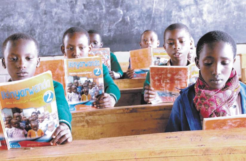 School children learn Kinyarwanda in class. (Net photo)