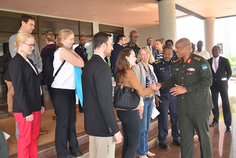Gen Nyamvumba greets members of the delegation when they called on him at his offices. (Courtesy)