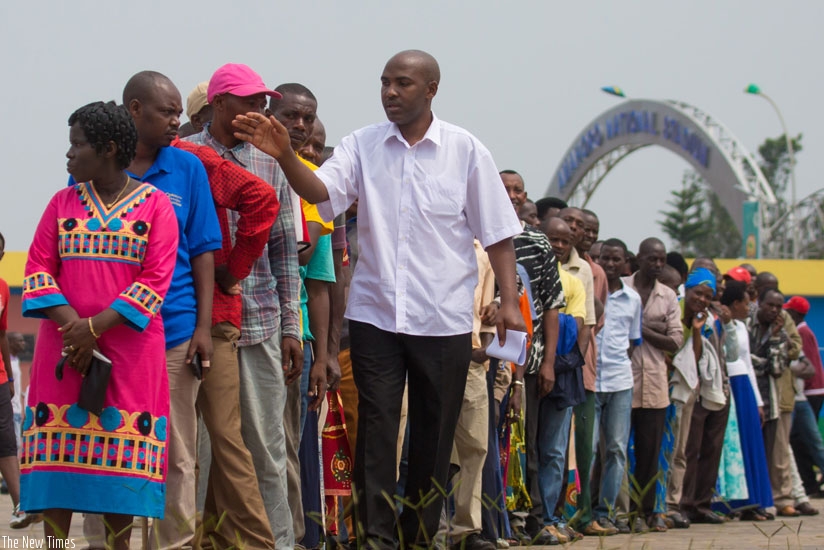 An electoral agent counts voters during the elections for village leaders at Marembo ya Mbere, Gasabo District, last week. Ballot papers will be used for district council polls. (Timothy Kisambira)