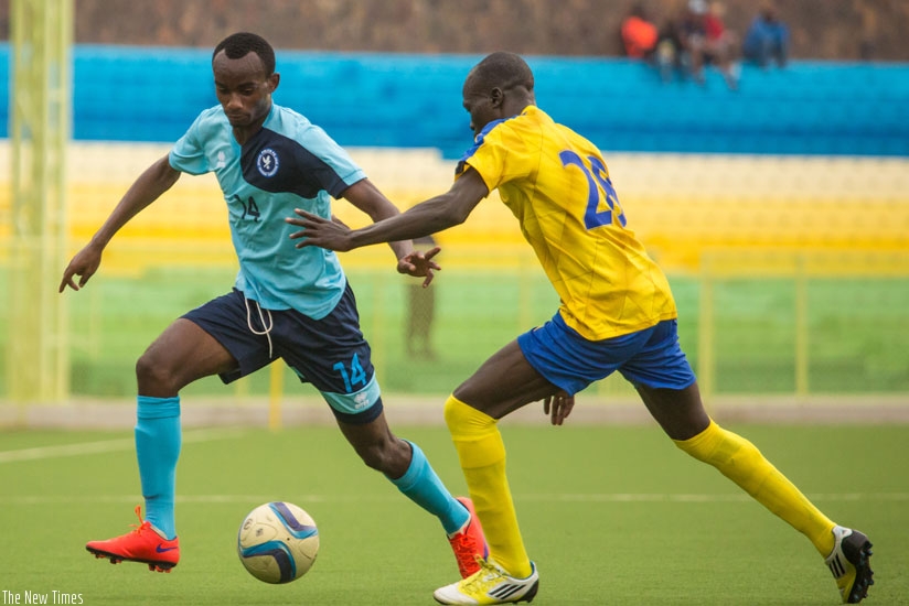 Usengimana (L), who scored the first goal for Police, takes on Altabara defender Jackson Alhas Juma at Kigali Regional Stadium. Police FC won 3-1. (Timothy Kisambira)