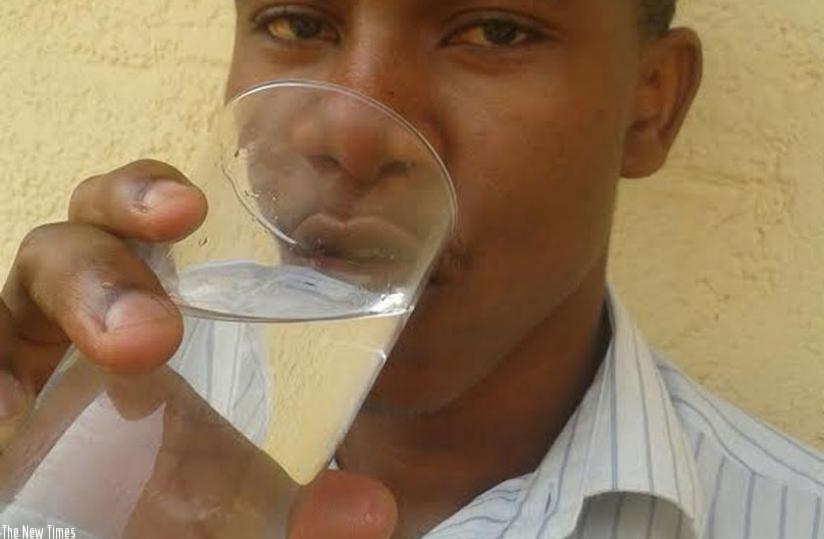 A man drinks water. It is advisable to drink water using clean utensils to avoid contamination. (Solomon Asaba)