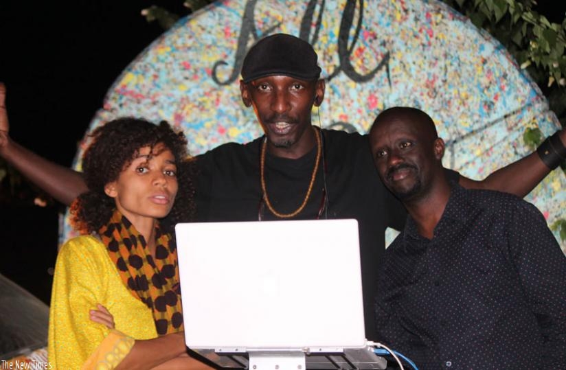 DJ Eric Soul behind the decks. On his left is Judo Kanobana of Positive Productions, and to his right is Nigerian singer Nneka. 