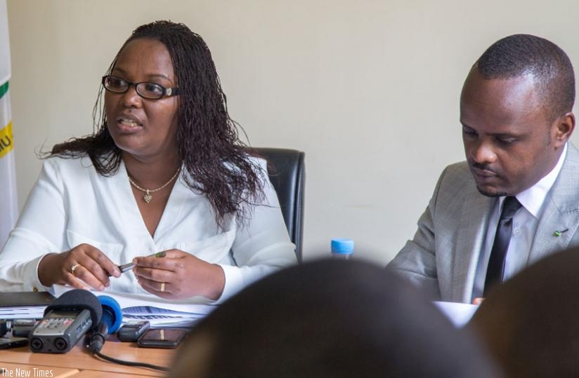 Dr Mukeshimana (L) speaks to the press while Minister Nsanganira looks on. Doreen Umutesi. 