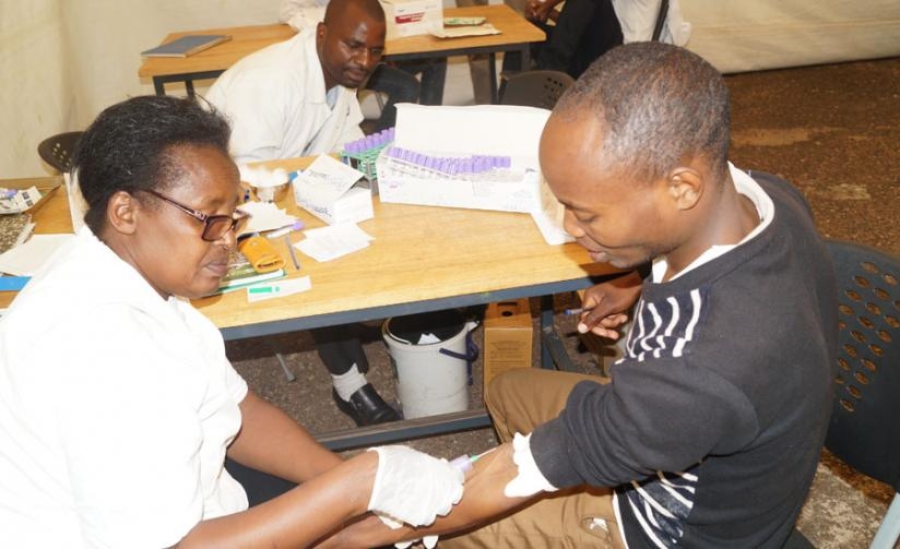 A university student gets tested for HIVAIDS during a voluntary testing exercise. (Frederic Byumvuhore)