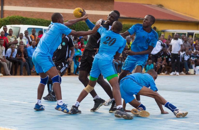 Police Handball Club battle with APR handball Club in Championships. (Timothy Kisambira)