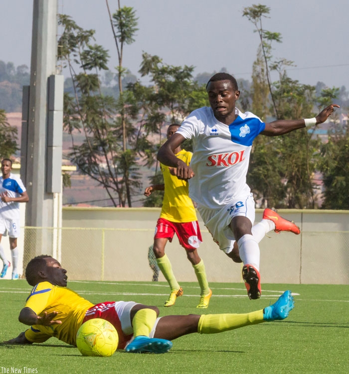 Rayon Sport FC winger Djabel Manishimwe jumps to avoid a tackle from AS Muhanga defender. (T Kisambira)