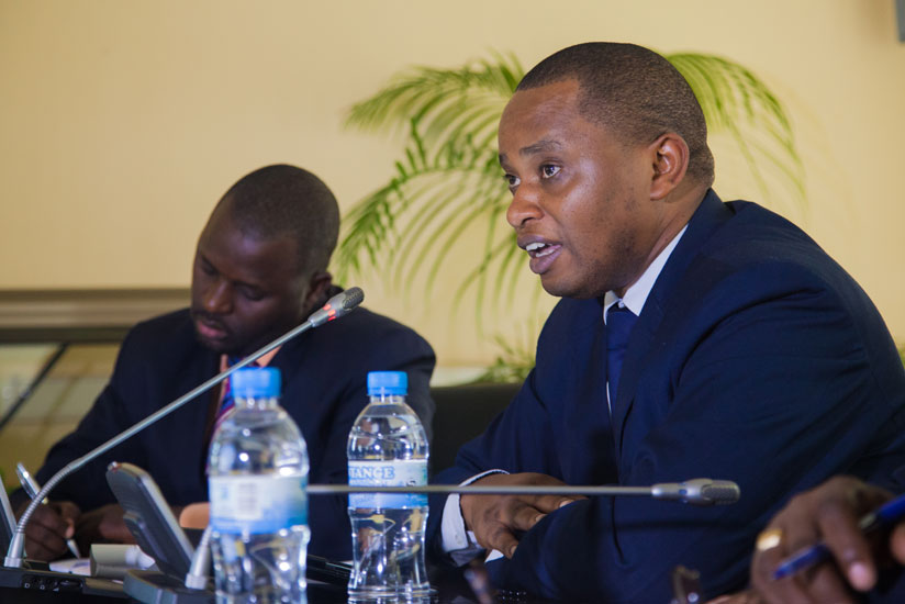 State Minister for primary and secondary education Olivier Rwamukwaya (R) speaks to the press as REB chairperson Janvier Gasana takes notes. (Faustin Niyigena)
