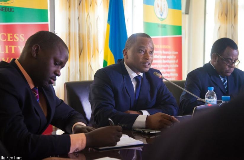 Minister Rwamukwaya (C) speaks after releasing the results yesterday as Rwanda Education Board director-general Janvier Gasana (L) and George Njoroge, the principle of University of Rwanda's College of Education take notes. (Faustin Niyigena)