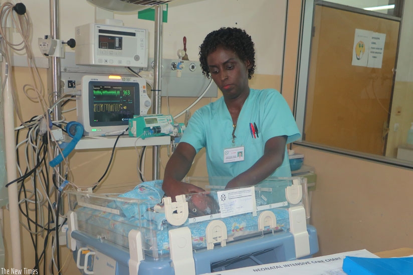 A nurse attends to a premature. Constant monitoring is essential. (Solomon Asaba)
