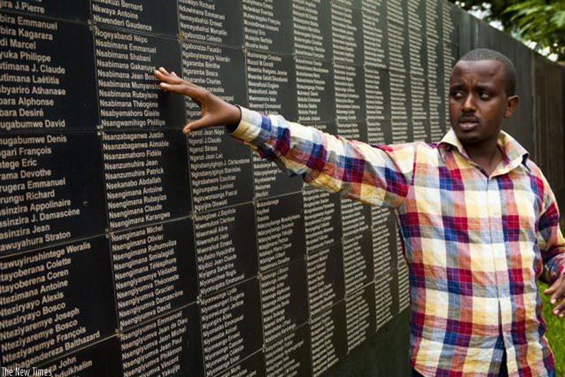 A guide at the Kigali Memorial Centre showing a list of victims of the 1994 Genocide against the Tutsi. (File)
