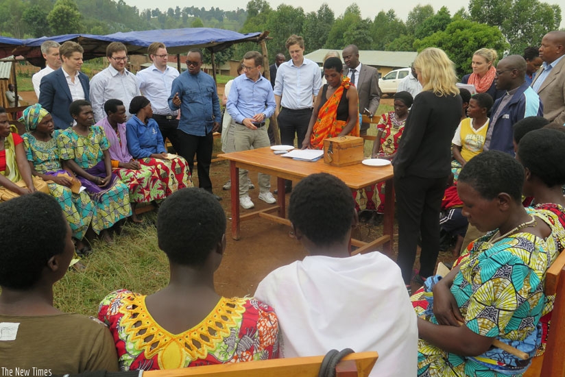 Swedish parliamentary committee members speak to Twizerane Saving Group during their tour. (Michel Nkurunziza)