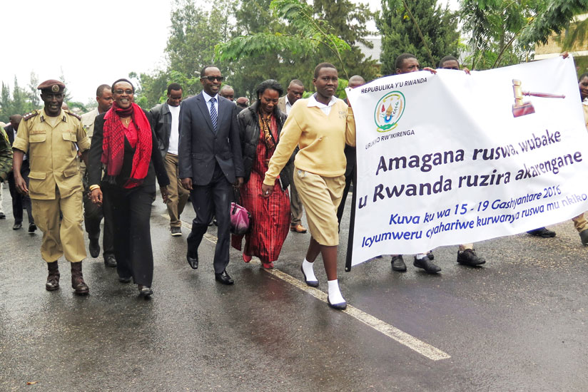 Officials, including Marie-Immaculee Ingabire, the Transparency International Rwanda Executive Director (2nd L), Southern Province Governor Alphonse Munyantwali (C) and the Supreme Court Vice-President Zainabu Sylvie Kayitesi (on Munyantwali's left) lead the anti-corruption march in Nyanza District on Friday. (Emmanuel Ntirenganya)