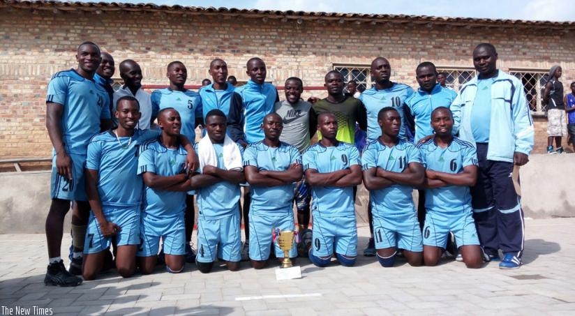 Police handball club players and officials pose with the trophy after winning the Heroesu2019 Day tournament. (G. Asiimwe)