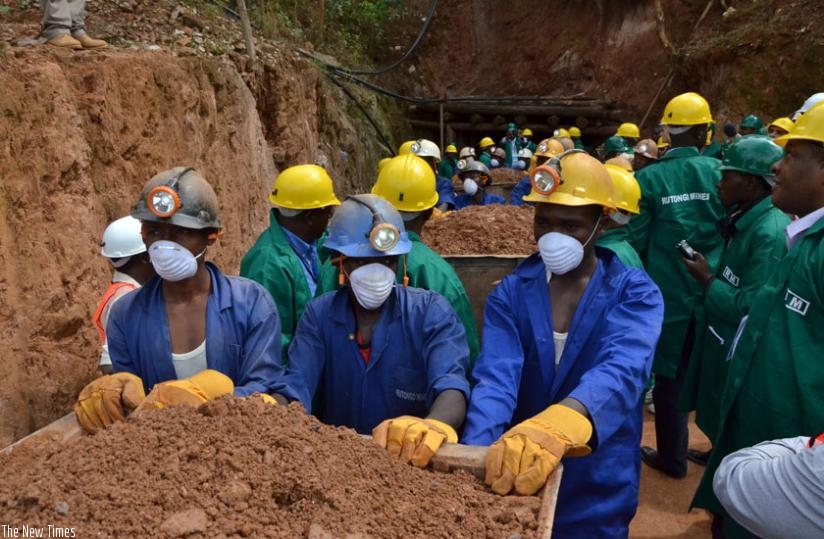 Miners leave a tunnel at Rutongo Mines in Rulindo District. (Timothy Kisambira)