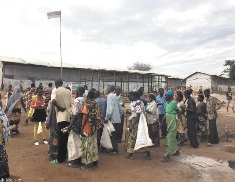Burundian refugees line up for distribution of rations in Mahama camp. (Net photo)
