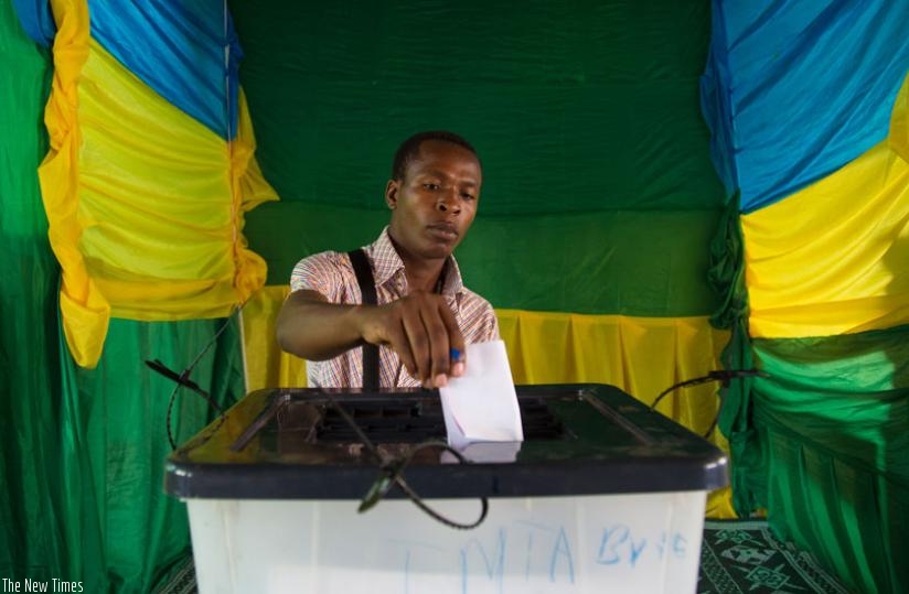 A resident of Kicukiro casts his vote at Kicukiro Primary School on Monday. (File)