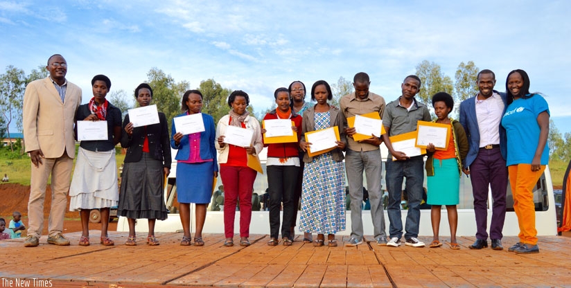 Recognized caregivers from Gikomero pose with Fidele Ingabire, the Sector Education Officer (first left), Assumpta Ingabire, ECD Technical Advisor at Imbuto Foundation (second row), and Albertine Uwimana, a representative from Unicef (first right). (Courtesy)