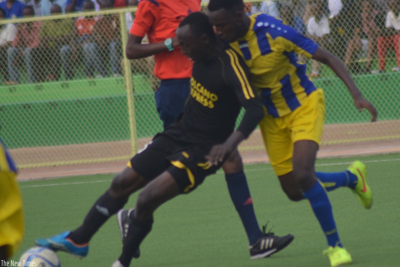 Mukura striker Christophe Ndayishimiye protects the ball against AS Kigali defender Sothere Kayumba on Wednesday. (Peter Kamasa)