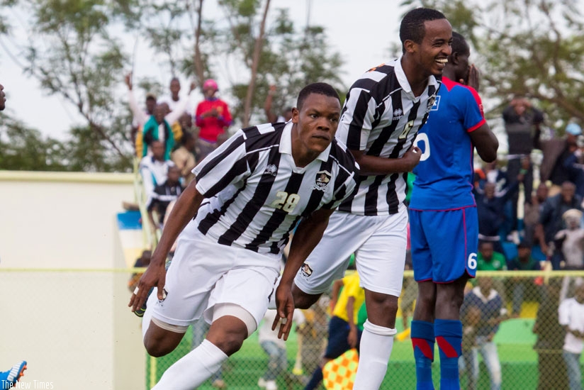 Abdul Rwatubyaye (28) wheels away together with Yannick Mukunzi to celebrate his hat trick. APR won 4-1at Nyamirambo Regional Stadium. (Timothy Kisambira)