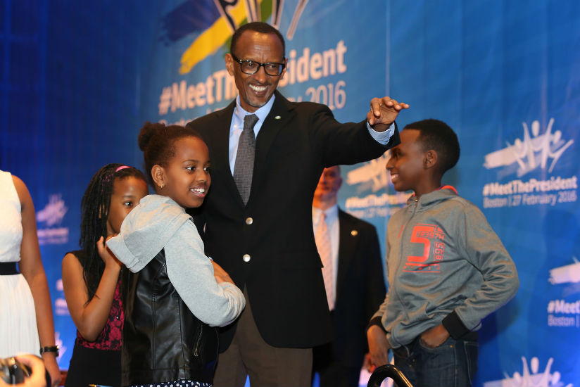 President Kagame shares a light moment with children during his meeting with the Rwandan community in Boston, USA. (Village Urugwiro)