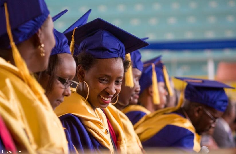 Graduates share a light moment during a past graduation ceremony at Petite Stade yesterday. (File)