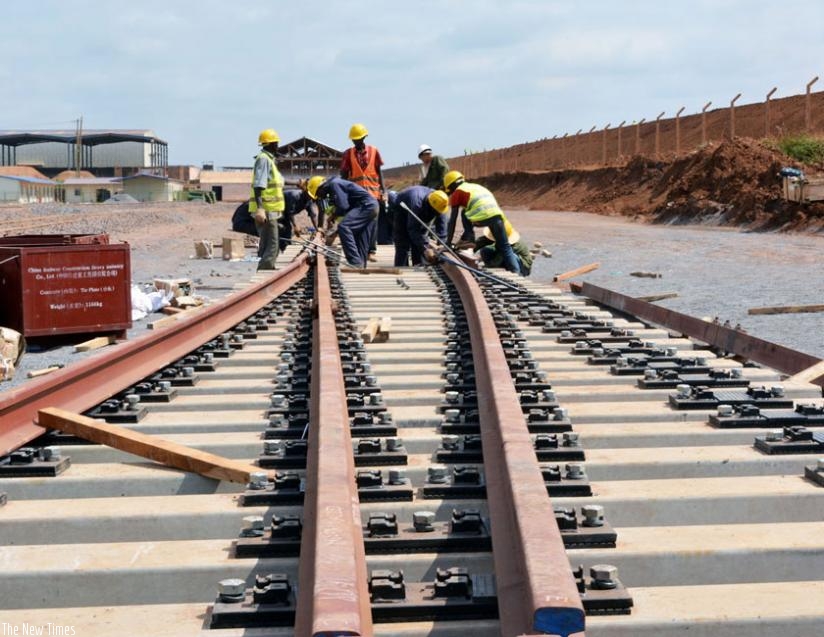 Workers construct a railway line in Kenya. (Net photo)