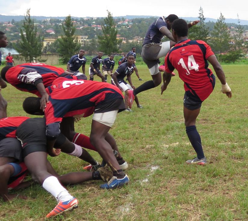 Muhanga's Laurien Hakizimana (#14) kicks for territory against Thousand Hills in last year's play-offs. (S. Kalimba)