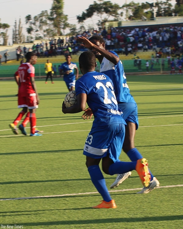 Pierro is saluted by Kasirye after converting a late penalty against Espoir in the league match on Saturday at Kigali regional stadium. (Sam Niyonziza)