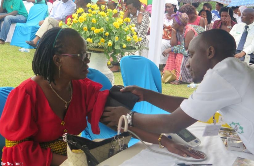 A woman undergoes a medical checkup during the screening on Friday. (Steven Muvunyi)