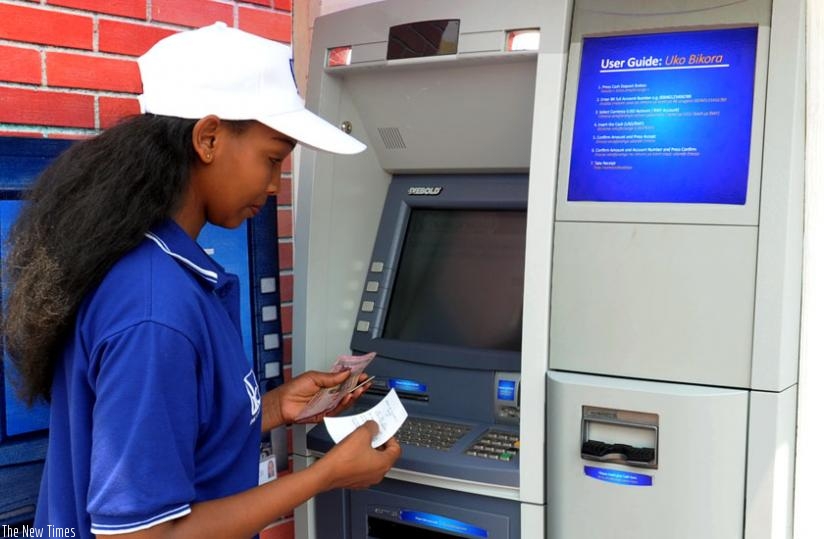 A woman withdraws money from an ATM. (File)