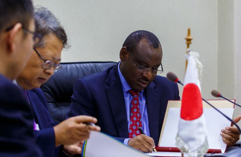 Sakamoto (L) and Gatete sign the funding agreement yesterday. (T. Kisambira)