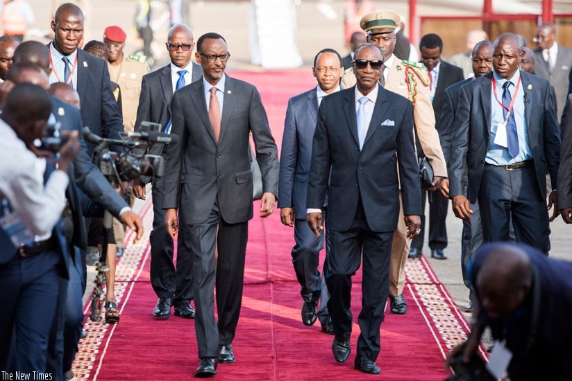 President Kagame was received by his Guinean  counterpart Alpha Conde (R) on his arrival to the West African country on Tuesday. (Urugwiro Village)