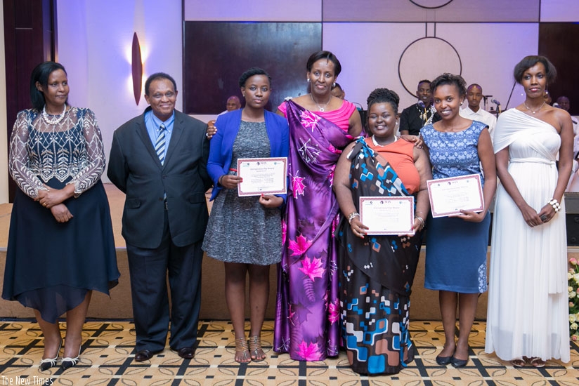 The First Lady poses with (L-R) Gender minister Oda Gasinzigwa; IFC president Ignace Bacyaha Rusenga; the three awardees Ysolde Ishimwe, Christelle Kwizera, and Colombe Ituze Ndutiye; and Mireille Karera, the event director Global Women's Summit, at the gala dinner on Tuesday.