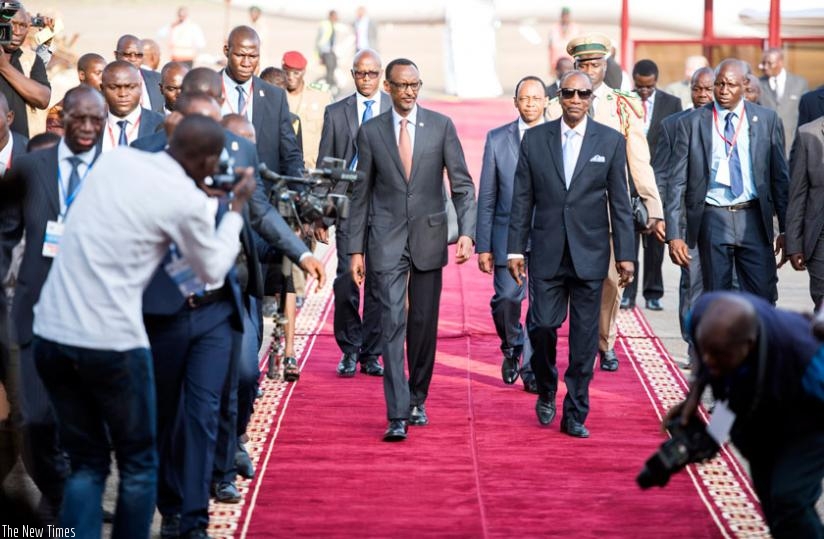 President Kagame was received by his Guinean counterpart Alpha Conde (R) on his arrival in the West African country on Tuesday. (Village Urugwiro)