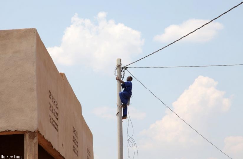 An electrician repairs an overhead line. Electricity access rollout programme is one of those that PAC has highlighted as stalling public project. (File)