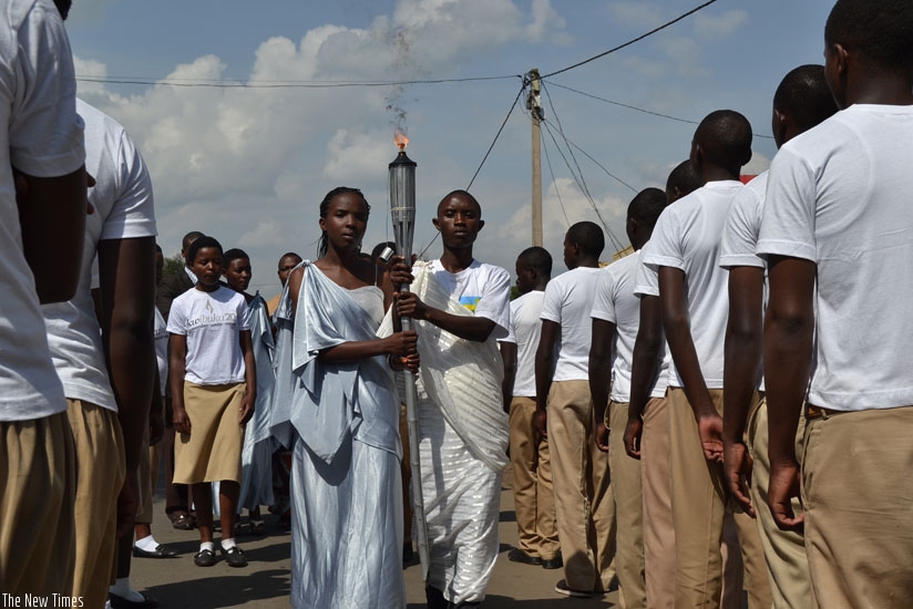 Youth carry a flame during Kwibuka20. This year's commemoration will focus on fighting genocide ideology. (File)