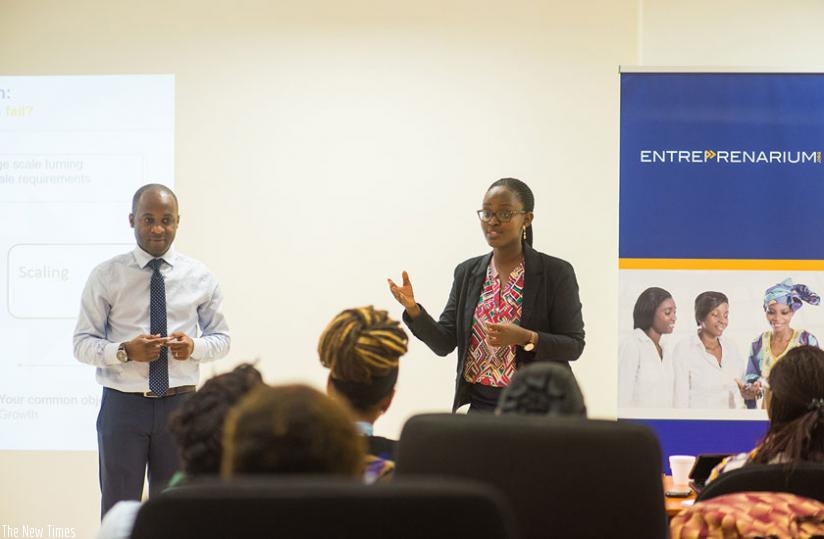 Yannick Ebibie, Managing Director, Entreprenarium Gabon (L), and Joelle Rubagenga, Office Manager, Entreprenarium Kigali at the training. (Peterson Tumwebaze)