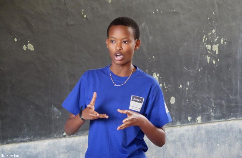 A student engages in a presentation during the Never Again Rwanda 2016 public speaking competion at Group Scolaire Gatagara in Huye District on Saturday. (Courtesy)