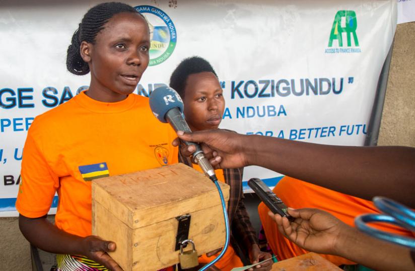 Gaudance Mukagasana explains to the media how the igiceri savings scheme works during Women's Day fete in Nduba Sector, Gasbo, last week. (Doreen Umutesi)