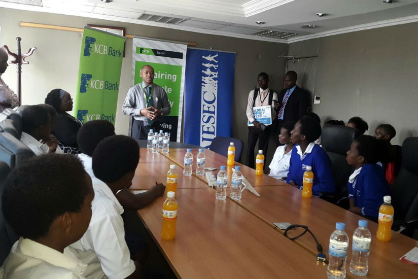KCB Rwanda's Managing Director talking to SOS students during global money week celebrations in Kigali yesterday. (Peterson Tumwebaze)  